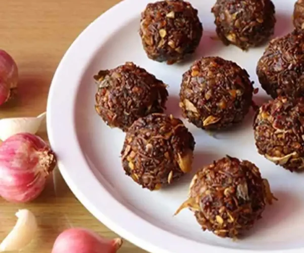 A plate full of DNachiys Onion Vadagam balls