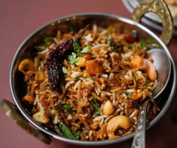 A bowl of rice mixed with DNachiys Puliyogare Mix